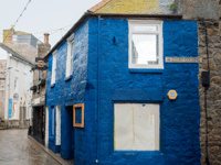 'Smurf blue’ shop repainted after complaints