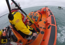 RNLI called to reports of people clinging to surfboard