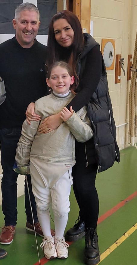 Champion fencer Beatrix with parents Dax and Jade