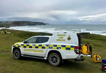 Dog walker airlifted to safety after being cut off by the tide