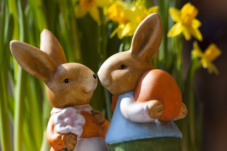 Easter bunny ornaments holding eggs 