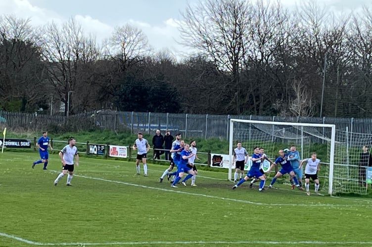 Action from St Austell (white) v Newquay on Good Friday.