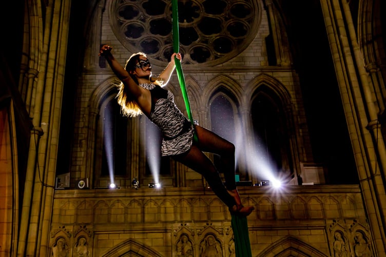 An aerial performer at Truro Cathedral's Masquerade Ball