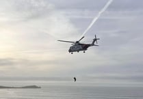 Two people airlifted to safety after being cut off by the tide