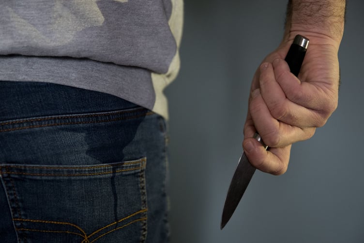 A model poses holding a knife. PA Photo. Picture date: Thursday January 16, 2020. Photo credit should read: Andrew Matthews/PA Wire