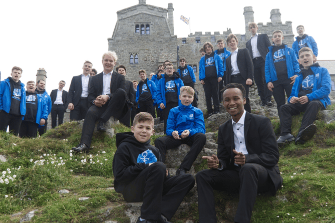A warm welcome on St Michael’s Mount for the blue-jacketed Atlantic Boychoir from Canada and Germany’s Ffortissibros – two of the choirs singing at the 2022 Cornwall International Male Choral Festival. Photo - Phil Monckton.