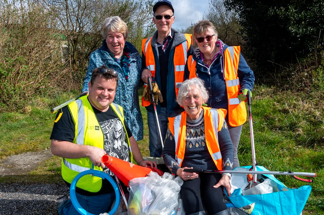 Pat Smith, bottom right with Cllr James Mustoe and volunteers at Caerloggas Downs. Picture: Paul Williams