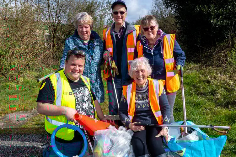 Pat Smith, bottom right with Cllr James Mustoe and volunteers at Caerloggas Downs. Picture: Paul Williams
