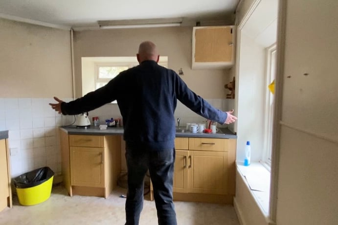 Simon giving us a tour of the kitchen in flat 1A