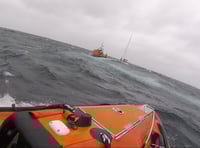RNLI lifeguards and lifeboat crews rescue yacht in difficulty 