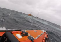 RNLI lifeguards and lifeboat crews rescue yacht in difficulty 
