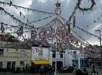 Local residents watch Obby Oss parade through pub