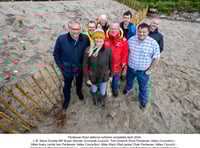 New sand dune structure created to protect village from flooding