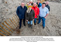 New sand dune structure created to protect village from flooding by the sea