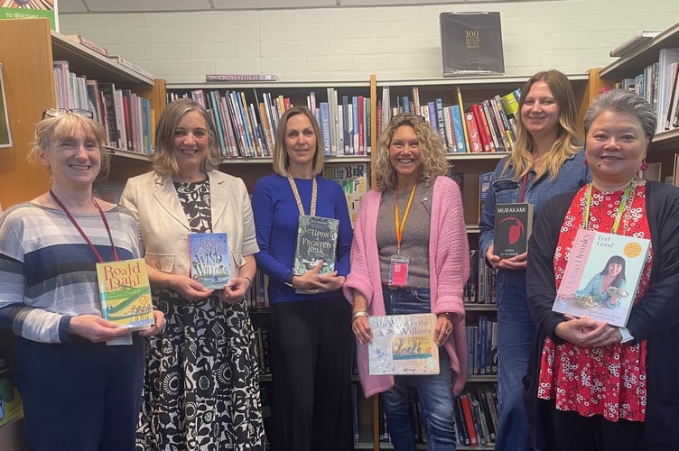 (from left to right) Sarah Bolton - Assistant Library Manager; Charlotte Caldwell - Town Clerk, Redruth Town Council; Tamsyn Dowling - Library and Information Assistant; Vicki Bampfield-Hammond - Arts Well; Willow Alston - Library and Information Assistant; Maria Moreno-Felstead – Library and Information Assistant; …all with their favourite books.