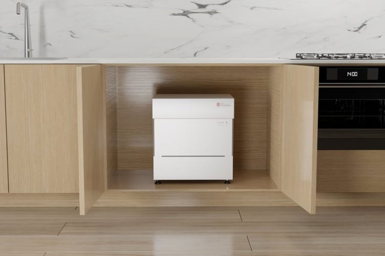 The Kensa Shoebox heat pump in a kitchen cabinet