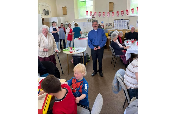 The Rev Paul Benney thanks the cooks for the meal and announces the amount raised.