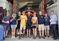 Couple walking the British coastline in aid of the RNLI visit Newquay 
