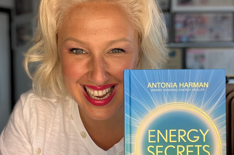 Antonia Harman, 43, with her book 'Energy Secrets'. Meet the real life wizard who claims she can "cure depression" by tuning into someones emotions and "reverse ageing" by increasing her cell voltage. Antonia Harman, 43, used to work as a TV presenter before completing a healing course - during which "opened her eyes" to the world of healing. She said that people "don't understand" when she says she is a wizard but she stands by it and explains her role. Antonia says she's spent the last 20 years in a "trance like state" - which enables her to tune into her "healing powers". She claims she can dissolve trauma and even heal physical ailments like cysts, tumours and arthritis. Over the years, Antonia has cured Diane Vickers tonsilitis and helped Lizzie Cundy with "emotional trauma".