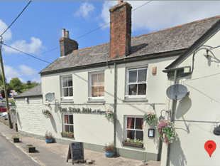 Pub evacuated after two caravans caught fire