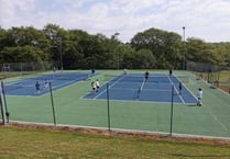 School pupils enjoy playing at tennis club