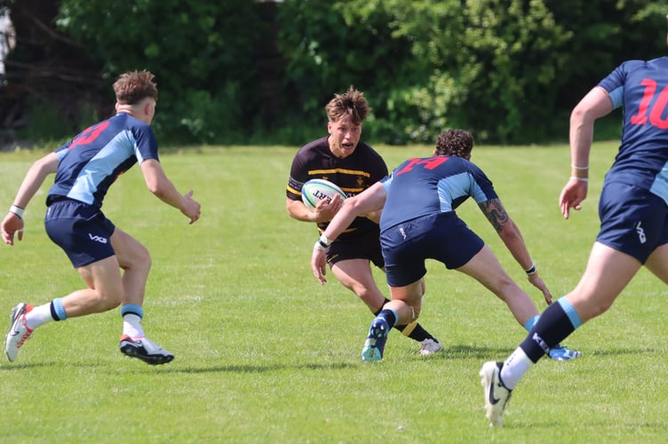 Full-back Harry Larkins, pictured on the ball, put in some big tackles for the Black and Gold. Picture: Gaynor Goss