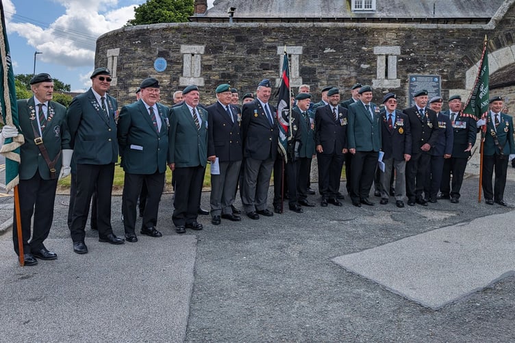 Veterans who took part in the ceremony gather for a photo