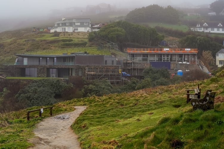 Kate Blanchett's Eco Home site in Mawgan Porth, Cornwall captured on the 28th February 2024 after locals continue to complain about the noise that the site is causing. See SWNS story SWLNblanchett. Cate Blanchett has been accused of 'total disregard' during construction of her eco-home in Cornwall - which has 'destroyed holidays' and cost a neighbour Â£60k.The Lord of the Rings star, 54, and her playwright husband Andrew Upton, 57, bought the Â£1.6 million cottage in Mawgan Porth four years years ago and has since demolished the original structure to replace it with a five-bedroom eco-home.But the ongoing renovations have angered her neighbours with the noise reportedly making the residents lives hell - and turning visitors away from the popular tourism beauty spot.And in the latest series of complaints after a fresh application for 'ground works' to allow car parking on an existing green meadow - was submitted, one neighbour accused the Hollywood star of 'destroying' holidays of those visting - and costing them Â£60k in lost revenue.
