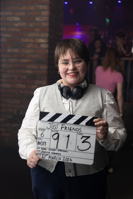 Rebs Fisher-Jackson on set