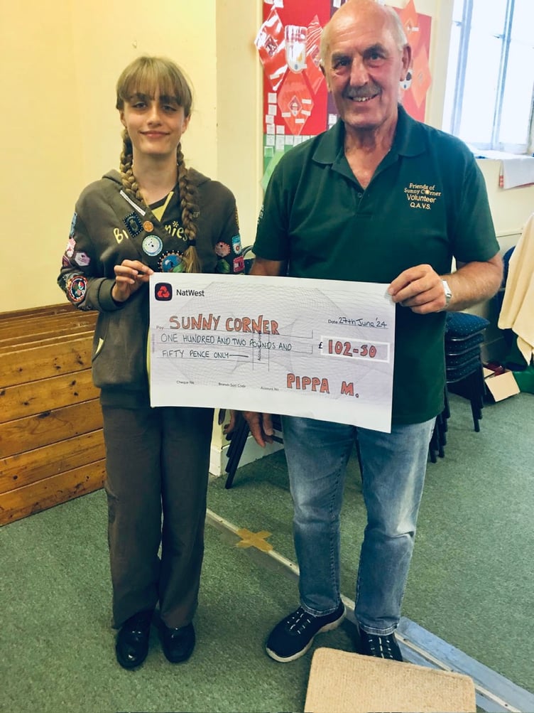 Pippa Mason presents Paul Caruana with a cheque