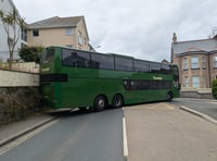 Traffic disruption ensues after bus hits wall 