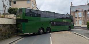 Traffic disruption ensues after bus hits wall 