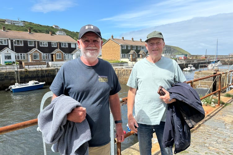 Tim Penaluna, left, and David Shields take a walk around Portreath harbour