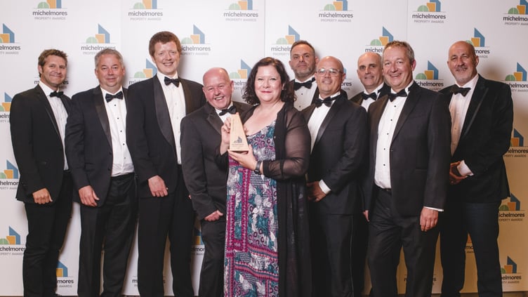 Roberta Fuller and the project team accept the award