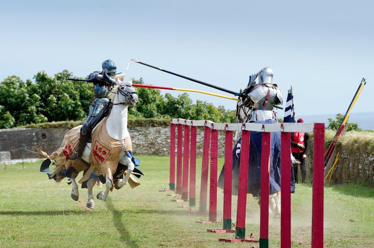Grand Medieeval Joust - Pendennis Castle, Cornwall. Dominic Sewell (Blue) and first English Heritage Female Jouster Nicky Willis (Gold).