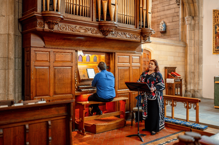 Soprano Luisa Torres entertained attendees, accompanied by Jeremiah Mead playing the 18th-century Byfield Organ  