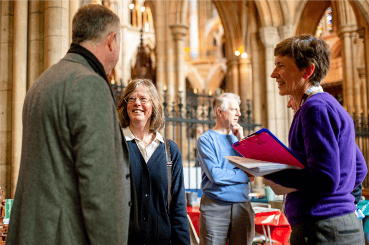 Dean Simon Robinson, Cecilia Bisson (Chair, Cornwall Historic Churches Trust) and fundraising lead Judith Field with attendees at the celebration event 