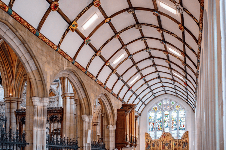 A view of the Aisle with triptych, commemorative ceiling bosses and 18th-Century organ 