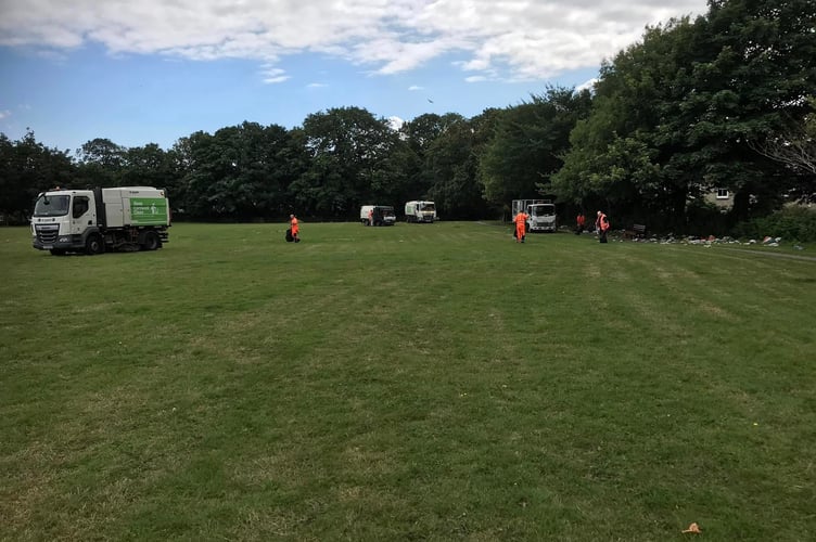 Biffa operatives working in Tremorvah park after the departure of the Traveller community