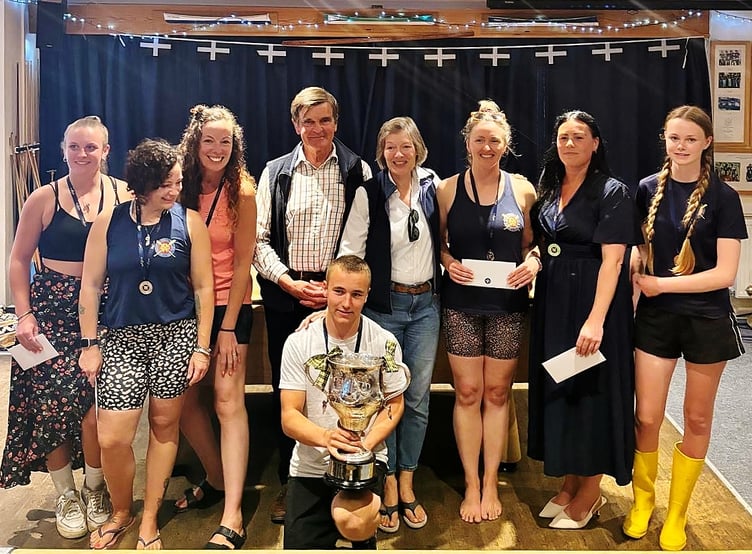 Carolyn and John Armstrong, pictured in the centre of the back row, present The Headland Cup to the winning crew.
