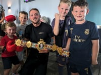 Boxer receives a hero's welcome after winning British title
