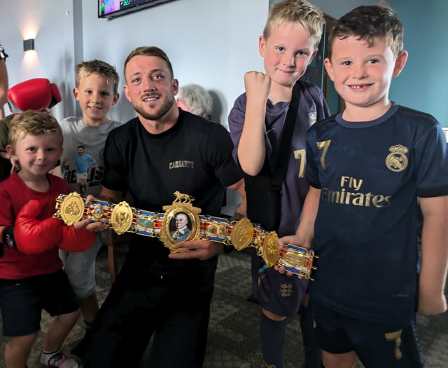 Boxer receives a hero's welcome after winning British title