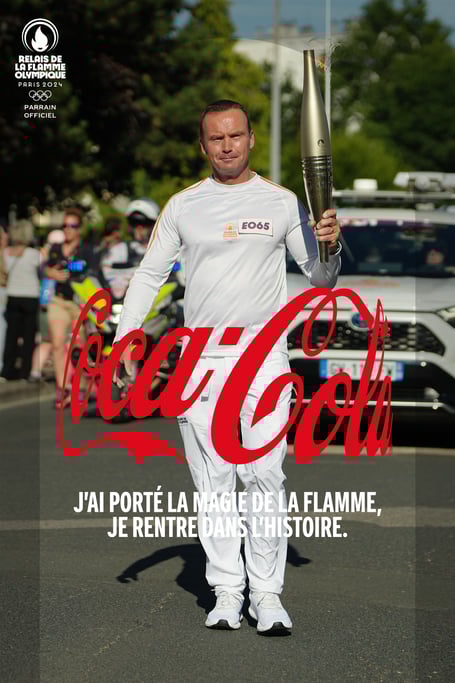 Carrying the torch for the Olympics: Saltash's Del Phillips was an official torchbearer in the relay around France.