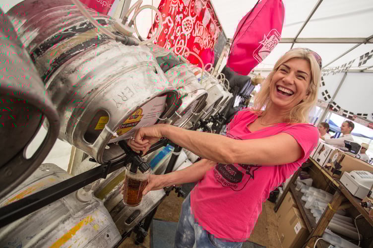 Sally Pickles, landlady of the Bowgie Inn, pulling a pint at the Ale Festival