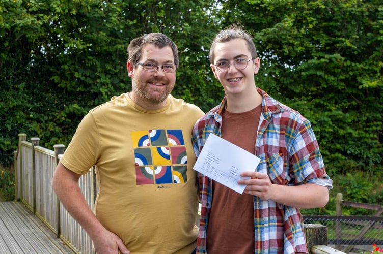Tyler and his father celebrating his results at Bodmin College