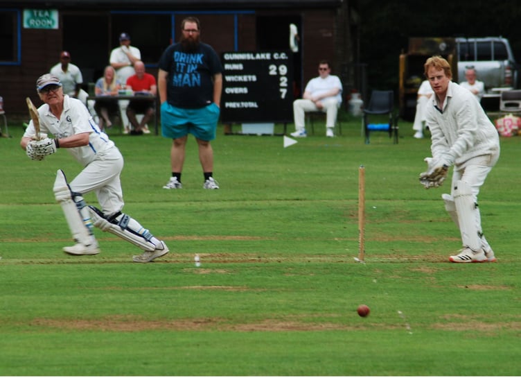 Gunnislake opener Stephen Lees plays a cut shot on his way to 30 against visiting Bugle on Saturday as wicket-keeper Paul Gribble watches on. Picture: Brian Martin/Gunnislake CC