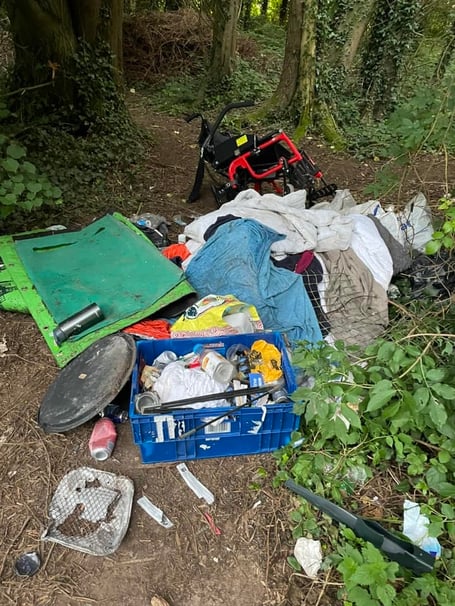Needle wrappers and rubbish left at the community orchard within the grounds of New County Hall in Truro