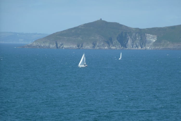 Yachts sailing off the distinctive promontory of Rame Head