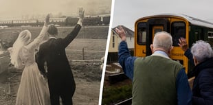 Couple recreate 65-year-old wedding photo waving at train