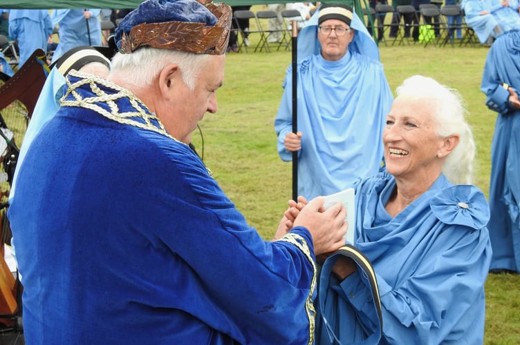 Sue Hill is barded by Grand Bard Pol Hidge at Gorsedh Kernow in Callington